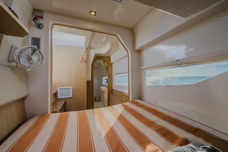 Slide: The Image of Interior of 2023 Aquila 36 Sport yacht cabin with ocean view. - 42