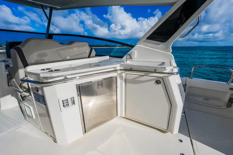 Slide: The Image of Luxury deck area of 2023 Aquila 36 Sport yacht with ocean view. - 24