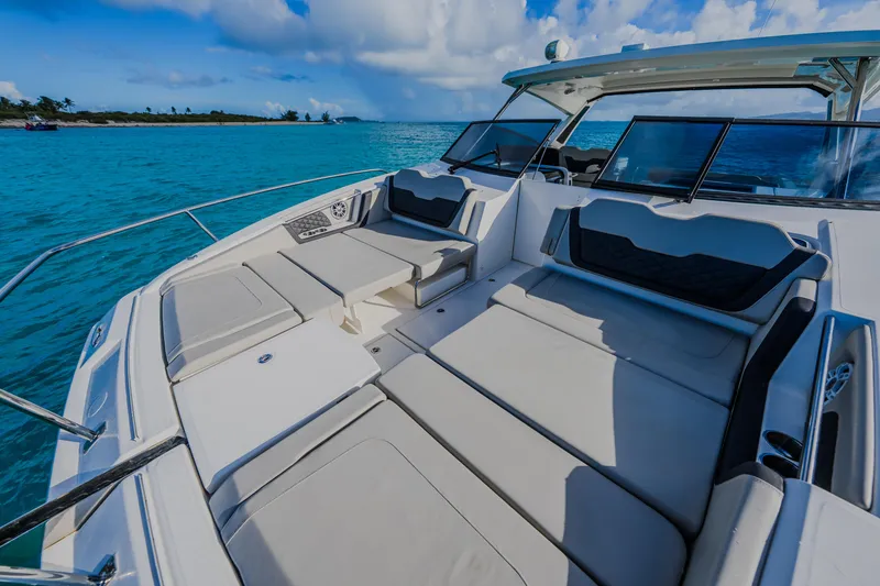 Slide: The Image of 2023 Aquila 36 Sport boat with spacious seating on turquoise waters. - 28
