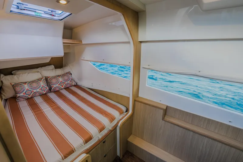Slide: The Image of Interior cabin of 2023 Aquila 36 Sport yacht with cozy bed and ocean view. - 43