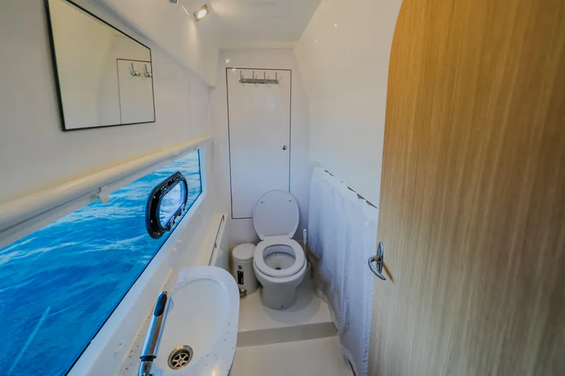 Slide: The Image of Bathroom interior of 2023 Aquila 36 Sport yacht with ocean view window. - 45