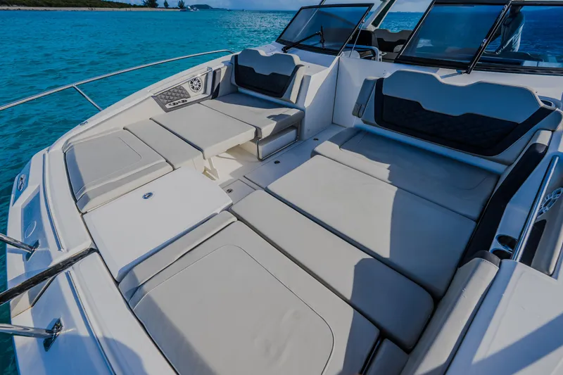 Slide: The Image of 2023 Aquila 36 Sport boat with spacious seating on clear blue water. - 30