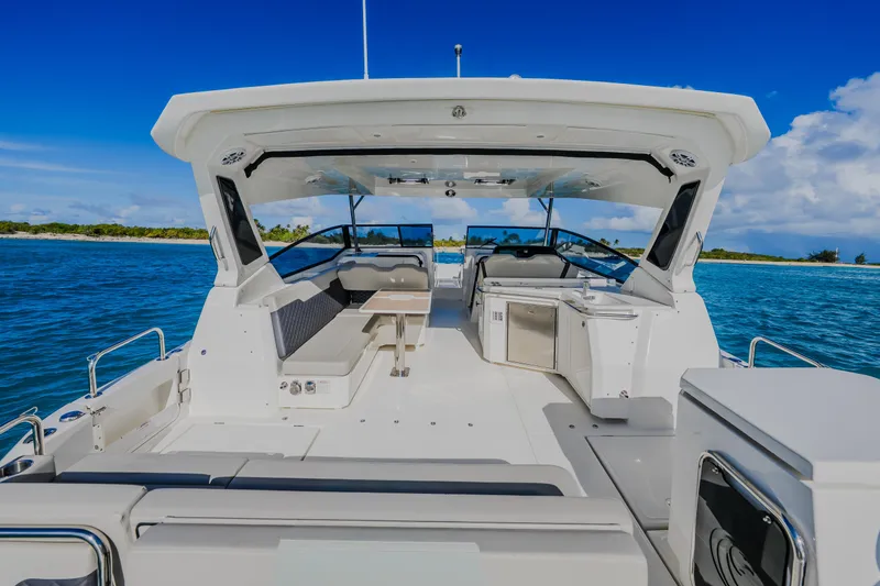 Slide: The Image of 2023 Aquila 36 Sport yacht interior with seating and ocean view. - 13
