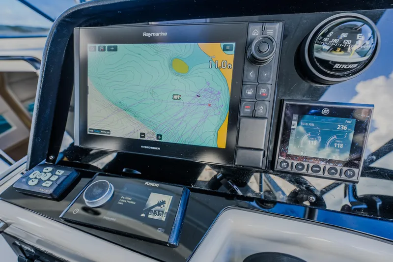 Slide: The Image of Dashboard of 2023 Aquila 36 Sport with navigation and fuel displays. - 38