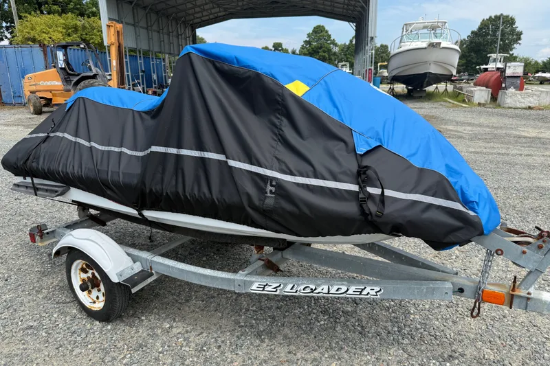 Slide: The Image of Covered 2002 Yamaha WaveRunner FX on trailer in outdoor storage area. - 13