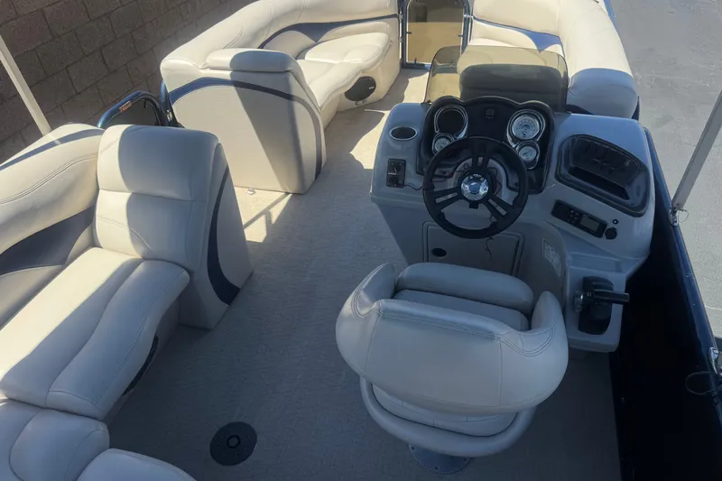 Slide: The Image of 2020 Aloha Pontoon Tropical TS 220 interior with plush seating and modern dashboard. - 19