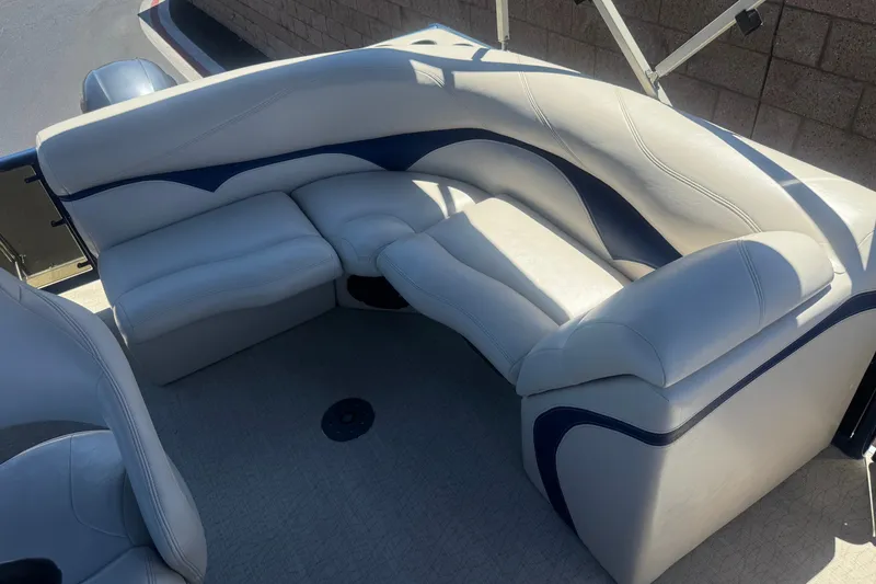 Slide: The Image of 2020 Aloha Pontoon Tropical TS 220 interior seating with white and blue upholstery. - 16