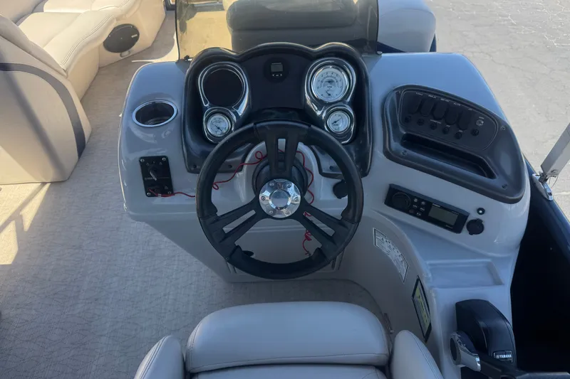Slide: The Image of Cockpit of 2020 Aloha Pontoon Tropical TS 220 with steering wheel and control panel. - 21