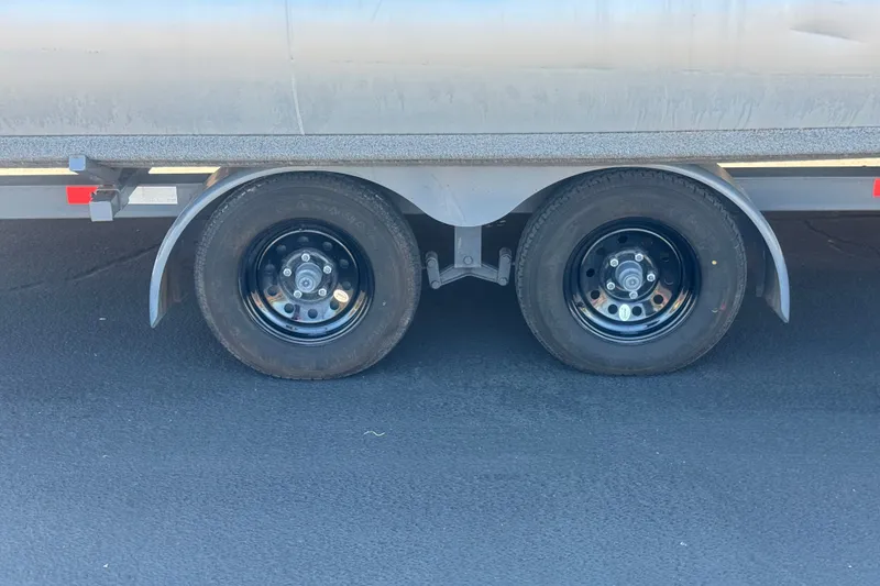 Slide: The Image of Dual wheels of a 2020 Aloha Pontoon Tropical TS 220 trailer on asphalt. - 22