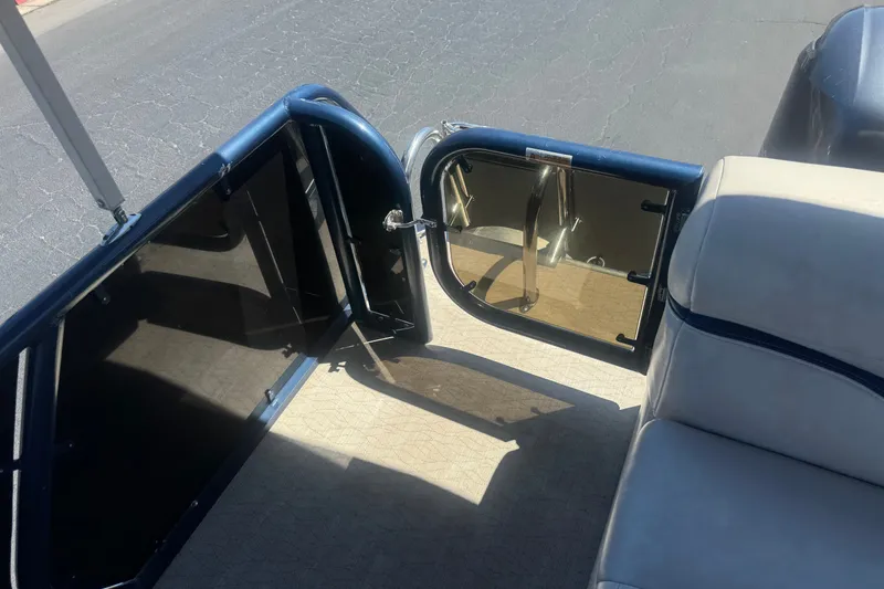 Slide: The Image of Open gate on 2020 Aloha Pontoon Tropical TS 220, showing interior seating and flooring. - 17