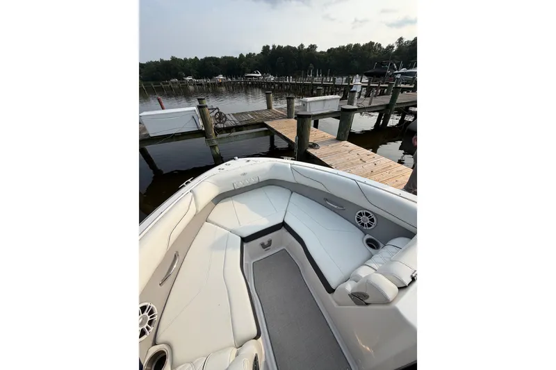 Slide: The Image of 2023 Regal LX2 boat interior at dock, featuring sleek seating and modern design. - 3