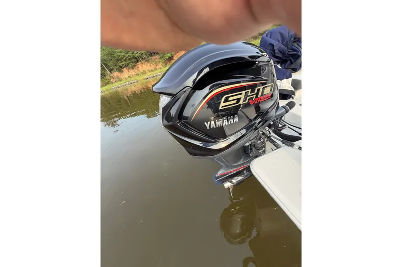 Slide: The Image of 2023 Regal LX2 with Yamaha SHO VMAX outboard engine on calm water. - 19