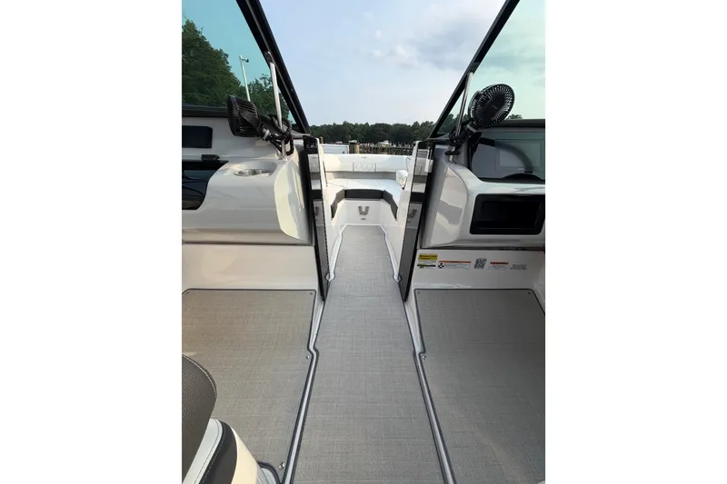 Slide: The Image of 2023 Regal LX2 boat interior with open deck and seating area. - 16