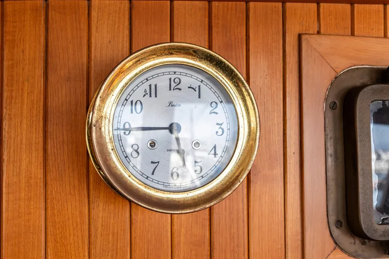 Slide: The Image of Brass ship clock on wooden panel, Kadey-Krogen 42, 1990 model. - 32