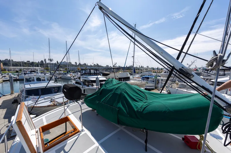 Slide: The Image of Kadey-Krogen 42 yacht from 1990 docked at a marina under a clear blue sky. - 55