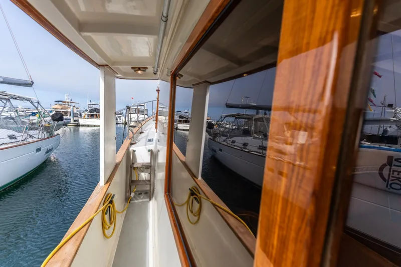 Slide: The Image of Side deck view of 1990 Kadey-Krogen 42 yacht in marina. - 13