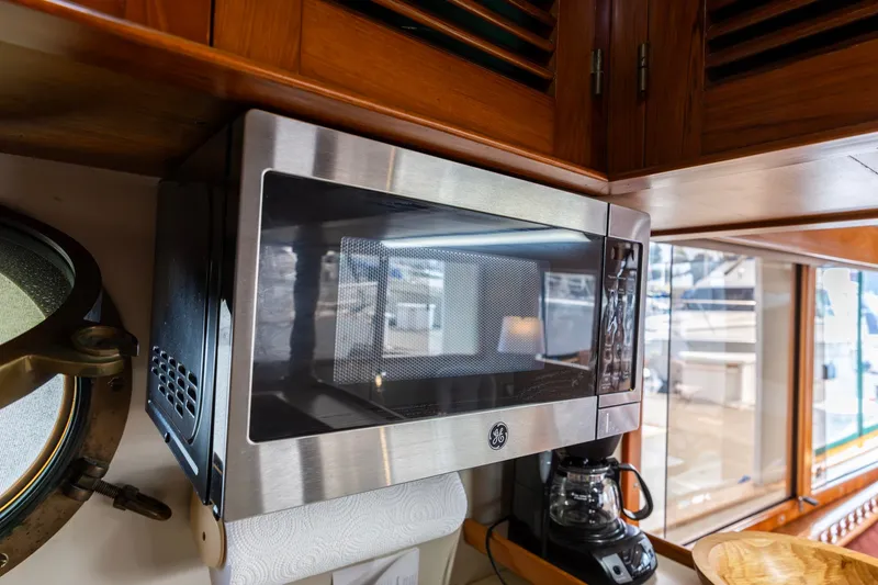 Slide: The Image of Microwave and coffee maker in 1990 Kadey-Krogen 42 yacht kitchen interior. - 26