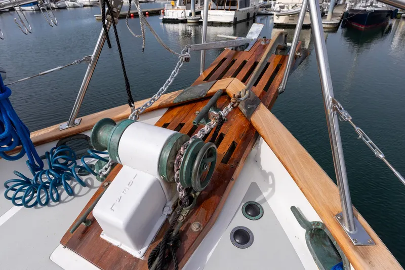 Slide: The Image of Bow of 1990 Kadey-Krogen 42 yacht with anchor and winch in marina. - 17
