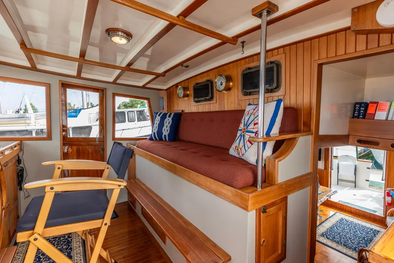 Slide: The Image of Cozy interior of 1990 Kadey-Krogen 42 yacht with wooden accents and nautical decor. - 8