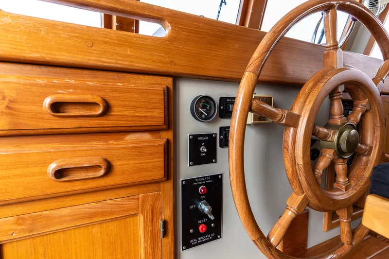 Slide: The Image of Wooden helm and control panel of a 1990 Kadey-Krogen 42 boat. - 38