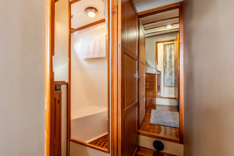 Slide: The Image of Interior of 1990 Kadey-Krogen 42 yacht featuring wooden cabinetry and cozy bathroom. - 47