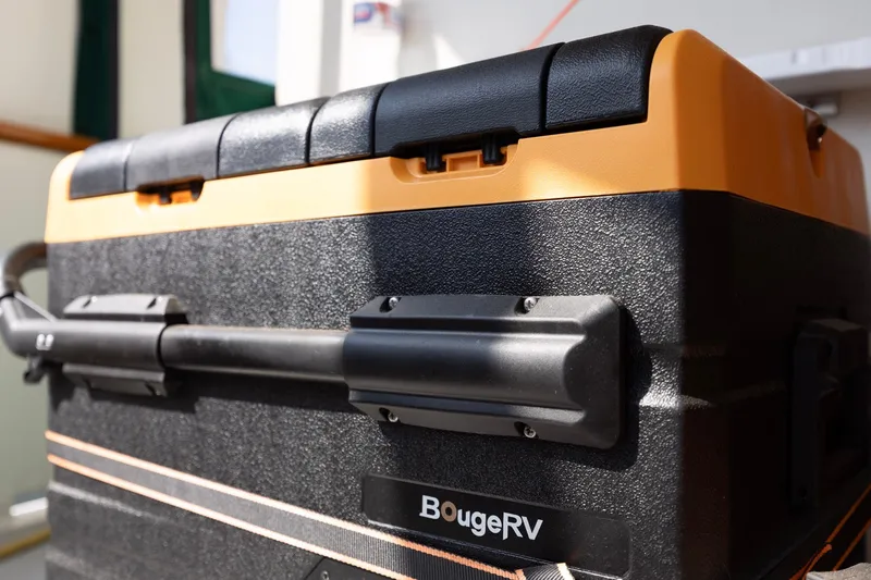 Slide: The Image of BougeRV cooler on Kadey-Krogen 42 boat, 1990 model, featuring durable black and orange design. - 51