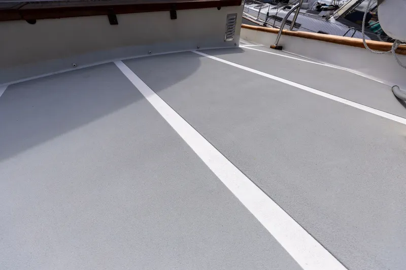 Slide: The Image of Deck of 1990 Kadey-Krogen 42 boat with non-slip surface and railing. - 19