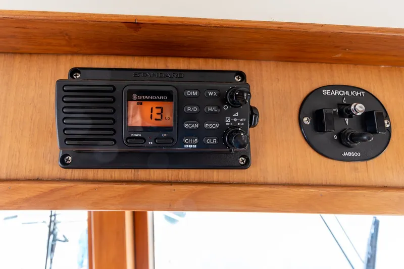 Slide: The Image of Standard radio and Jabsco searchlight controls on 1990 Kadey-Krogen 42 yacht. - 42