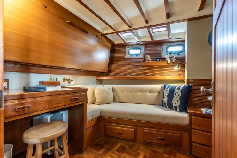 Slide: The Image of Cozy interior of 1990 Kadey-Krogen 42 yacht with wooden furnishings and plush seating. - 9