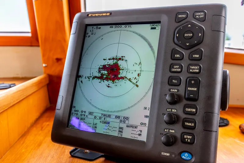 Slide: The Image of Radar display on a 1990 Kadey-Krogen 42 boat, showing navigation data. - 36