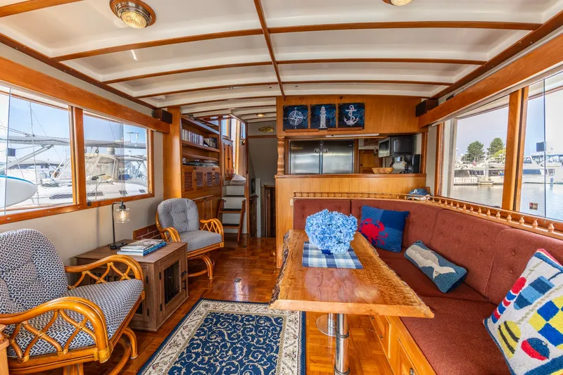 Slide: The Image of Luxurious 1990 Kadey-Krogen 42 yacht interior with elegant wood finishes and nautical decor. - 3