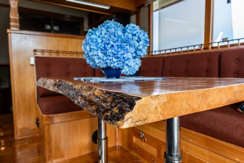 Slide: The Image of Elegant wooden table with blue hydrangeas on Kadey-Krogen 42 yacht, 1990 model. - 43