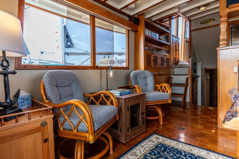 Slide: The Image of Interior of 1990 Kadey-Krogen 42 yacht with elegant wooden furnishings and comfortable seating. - 44