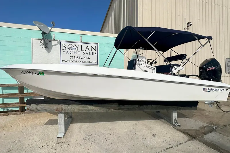 Slide: The Image of 2022 Paramount 21 boat at Boylan Yacht Sales, featuring a sleek design and canopy. - 1
