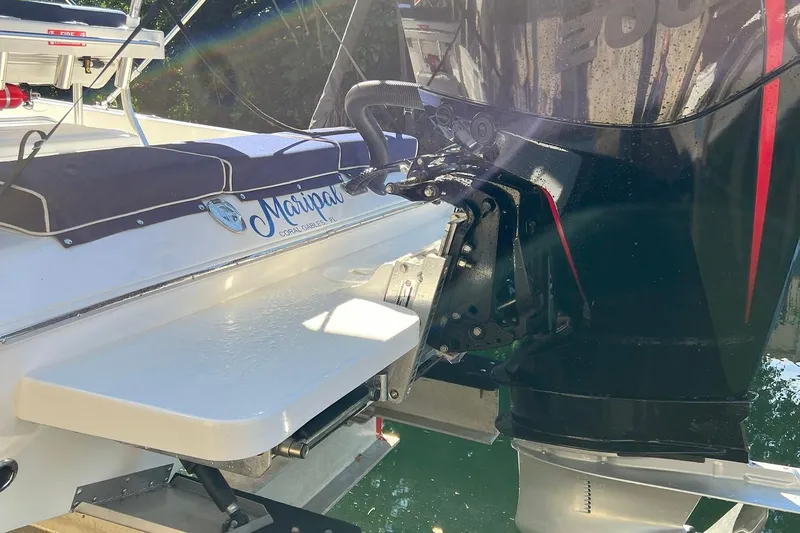 Slide: The Image of 2022 Paramount 21 boat with outboard motor, featuring "Maripai" name and Coral Gables, FL location. - 8