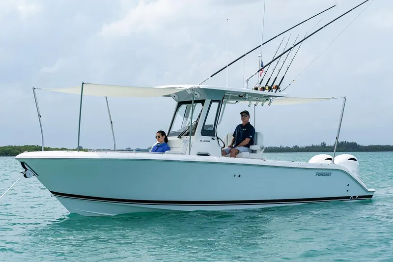 Slide: The Image of Manufacturer Provided Image: 2022 Pursuit S 268 Sport boat on water with two people onboard. - 29