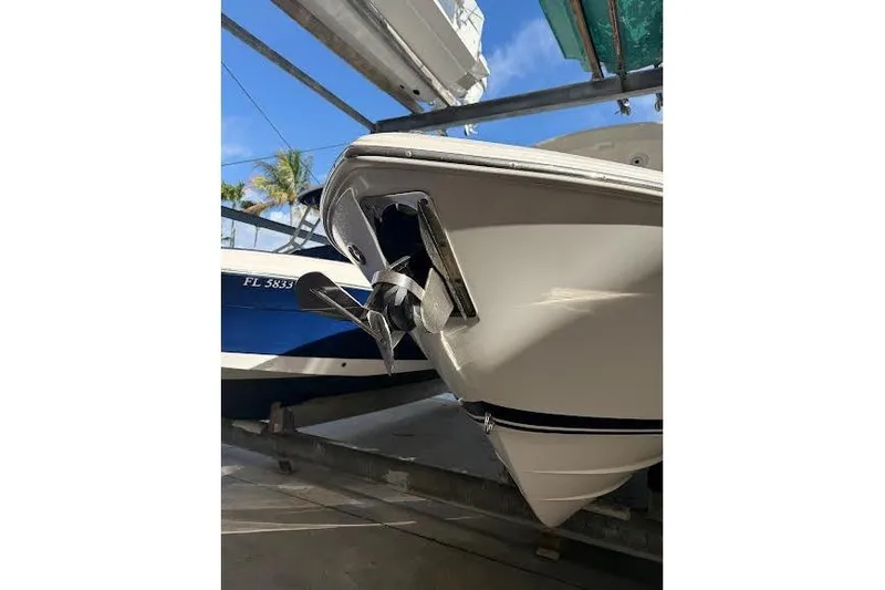 Slide: The Image of 2022 Pursuit S 268 Sport boat on trailer, showcasing bow and anchor detail. - 25