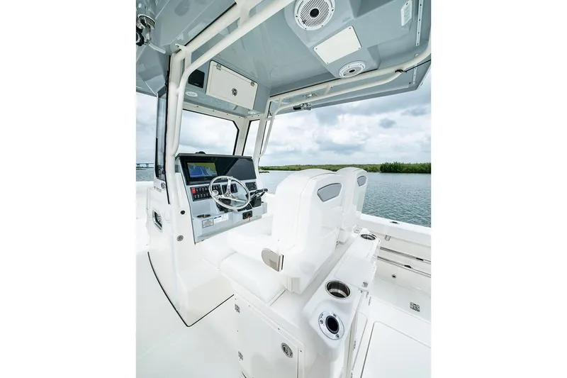 Slide: The Image of Manufacturer Provided Image: 2022 Pursuit S 268 Sport boat interior with helm and seating. - 37