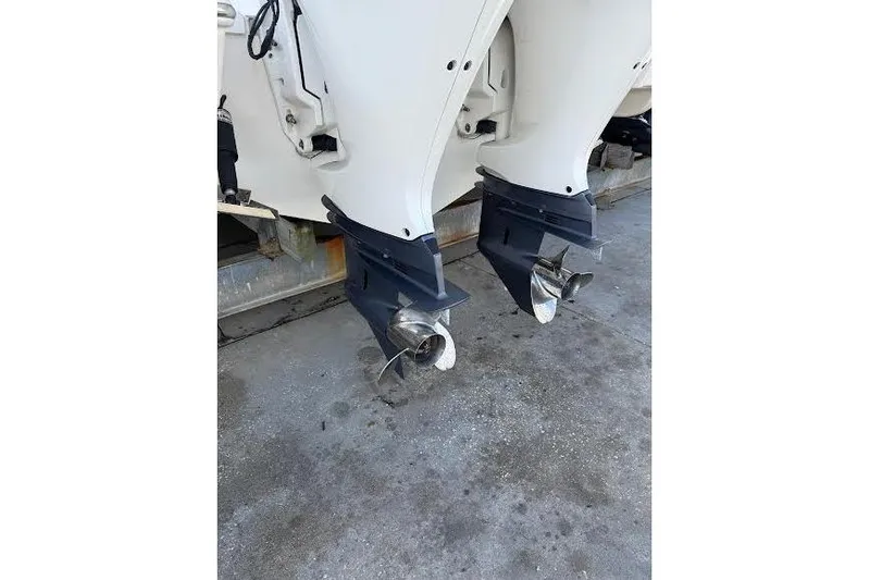 Slide: The Image of Twin outboard motors on a 2022 Pursuit S 268 Sport boat. - 23