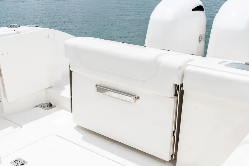 Slide: The Image of Manufacturer Provided Image: 2022 Pursuit S 268 Sport boat with white seating and dual outboard motors. - 41