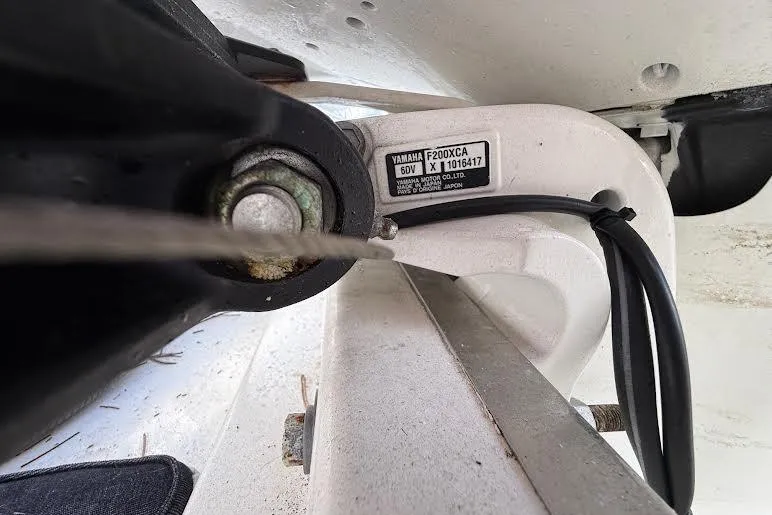 Slide: The Image of Close-up of Yamaha F200XCA engine part on 2022 Pursuit S 268 Sport boat. - 19