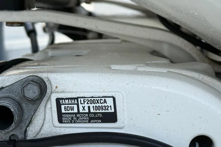 Slide: The Image of Close-up of Yamaha LF200XCA engine label on 2022 Pursuit S 268 Sport boat. - 26