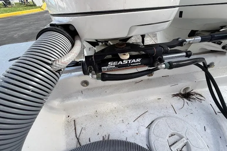 Slide: The Image of Hydraulic steering system on a 2022 Pursuit S 268 Sport boat, featuring SeaStar components. - 20