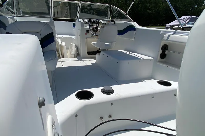 Slide: The Image of Interior view of a 2000 Seaswirl Striper 2100 boat, featuring seating and steering area. - 5