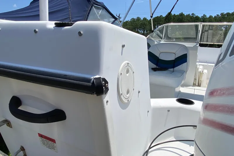 Slide: The Image of 2000 Seaswirl Striper 2100 boat interior with seating and speaker detail. - 7