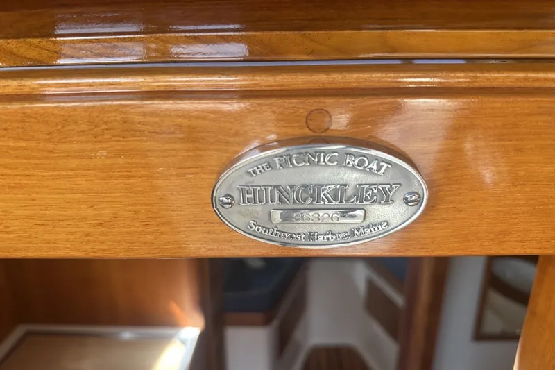 Slide: The Image of Hinckley Picnic Boat 36 EP 2005 nameplate, Southwest Harbor, Maine, on polished wood surface. - 38
