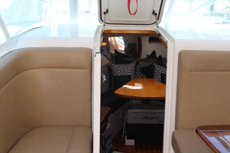 Slide: The Image of Interior of 2008 Contender 38 Express boat with cozy seating and stylish cushions. - 34