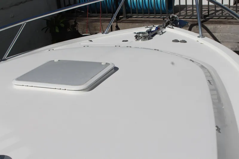 Slide: The Image of 2008 Contender 38 Express boat deck with hatch and railing. - 70