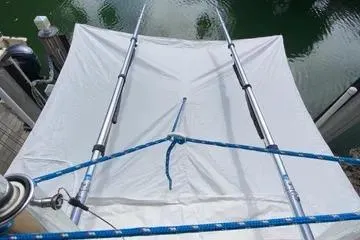 Slide: The Image of 2008 Contender 38 Express boat with a white canopy and blue ropes. - 25