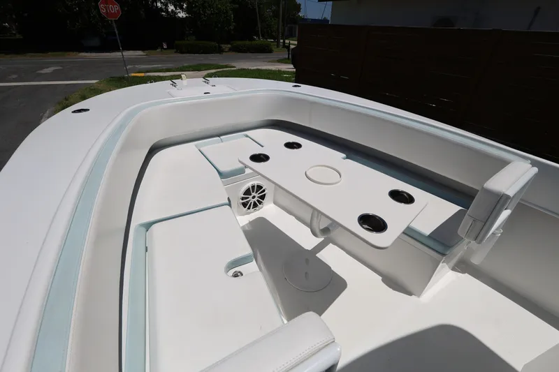 Slide: The Image of 2024 Dusky 278 XFY boat interior with seating and cup holders. - 14
